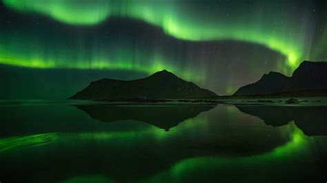 Beautiful Aurora Borealis Sky Above Mountain Reflection On Lake During