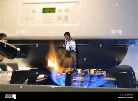 Man Jumping Out Frying Pan Hi Res Stock Photography And Images Alamy