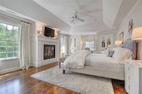 Romantic Bedroom With Fireplace And Closets With Mirrored Panels