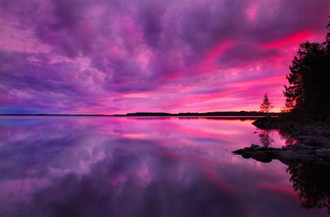 Dramatic Purple Pink Sunset Over Lake In Finland