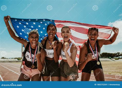 Group Of Athletes Celebrating Winning Gold Stock Image Image Of Flag Outdoors 180375269