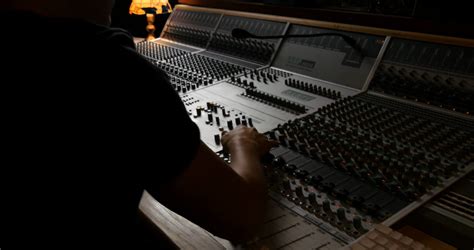 Recording music studio engineer mixing board sound desk in ...