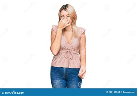 Young Caucasian Woman Wearing Casual Clothes Tired Rubbing Nose And Eyes Feeling Fatigue And