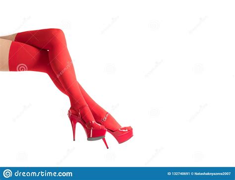Female Legs In Fetish Red Stockings And Red High Heels Isolated On