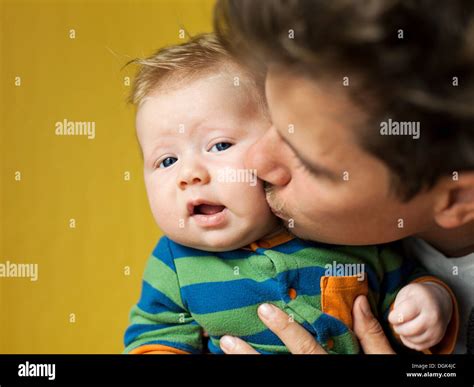 Father Kissing Baby Boy Stock Photo Alamy
