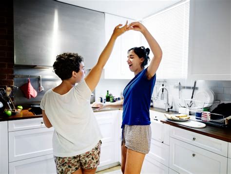 Premium Photo Lesbian Couple Dancing In The Kitchen
