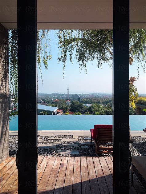 Windows Views Of A Infinite Pool And City From Inside Of A House Del