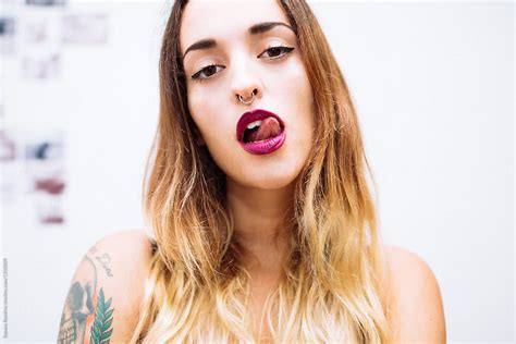 portrait of woman licking her lips by stocksy contributor susana ramírez stocksy
