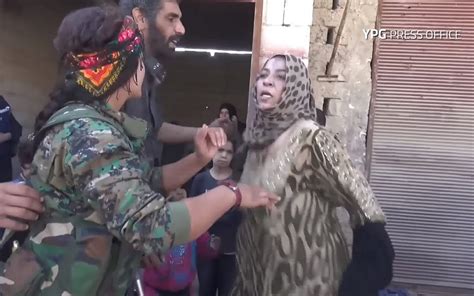 woman rips off oppressive garments as raqqa liberated from is the times of israel