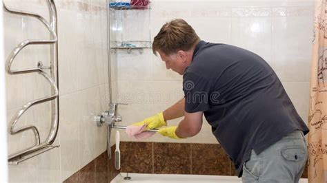 Tall Adult Man Yellow Rubber Gloves Helps His Wife Around The House