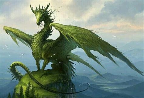 An Image Of A Green Dragon Sitting On Top Of A Tree