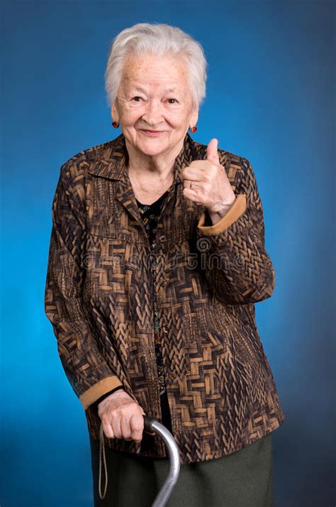 Smiling Old Woman Standing With A Cane Stock Photo Image Of Natural