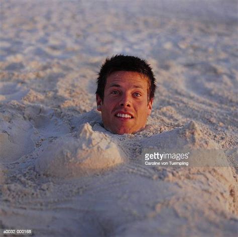 Man Buried In Sand Photos And Premium High Res Pictures Getty Images
