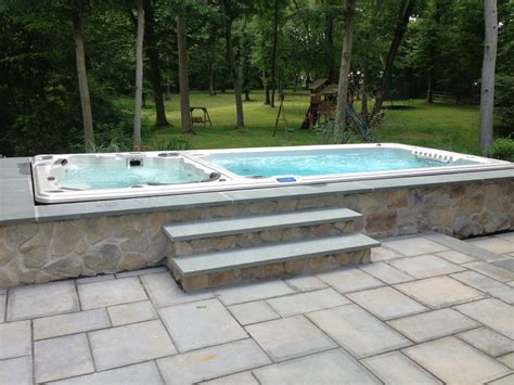 Hydropool Dual Temperature Swim Spa Installed In A Stone Enclosure Learn More About Hydropool
