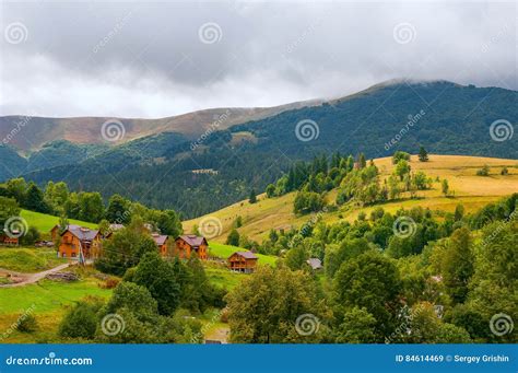 Beautiful Small Village Surrounded By Mountains And Forests Stock