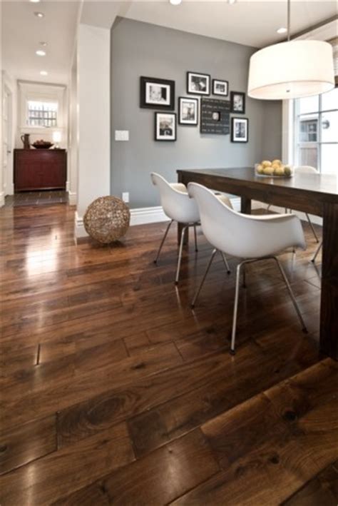 Think exposed duct work or pipes, metal furniture, exposed brick…gray hardwood floors of medium to darker grays work very well with this type of style. Great looking floor complimented by grey walls and white trim-LOVE the brown/gray/black color ...