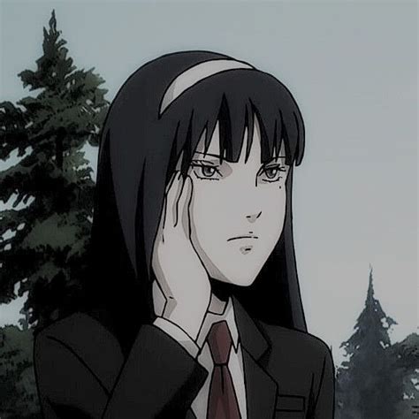An Anime Character With Long Black Hair Wearing A Suit And Tie Holding