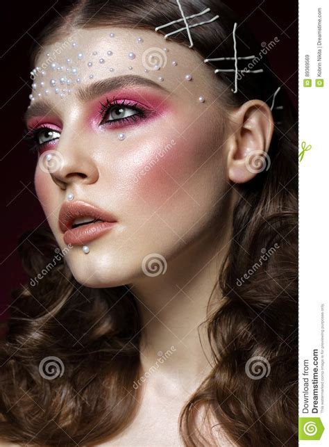 Beautiful Girl With Perfect Art Makeup And Pearl Beads