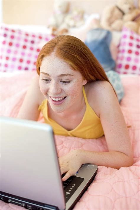 Teenage Girl Using A Laptop Computer Photograph By Ian Hootonscience