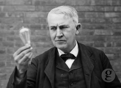Thomas Edison With A Light Bulb Thomas Edison