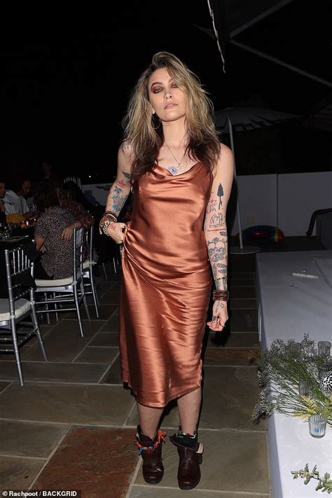 paris jackson shows off her sense of style in gold silk midi dress daily mail online