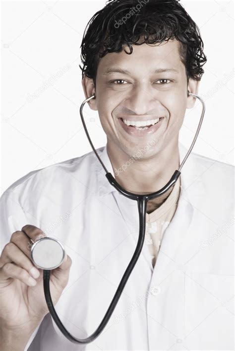Doctor Holding A Stethoscope — Stock Photo © Imagedbseller 32955397