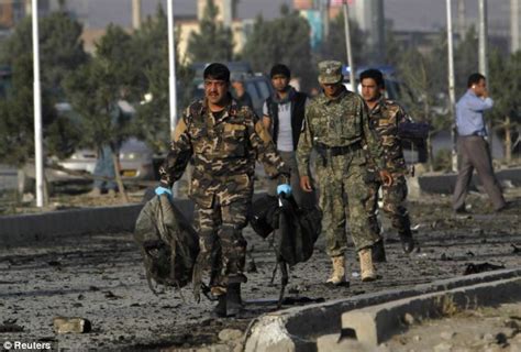 Body found in landing gear of transport plane that departed kabul airport; Suicide bombing in Kabul kills 12 | Daily Mail Online