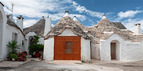 Some Trulli Houses In A Street Of Alberobello Puglia Italy Stock