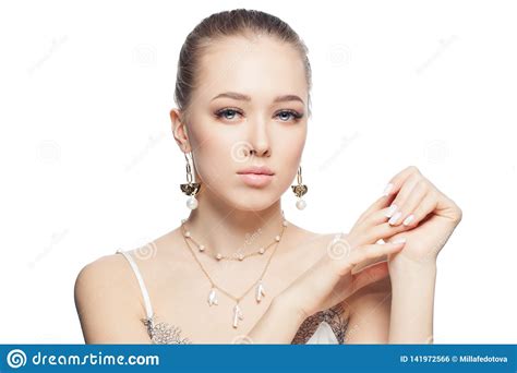 Closeup Female Face With Gold Necklace And Earrings With Pearls