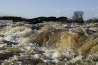 A flash flood is one in which the flooding is sudden and perhaps overwhelmingly forceful, generally following a dam burst or a heavy thunderstorm over a watershed. FLASH FLOOD | meaning in the Cambridge English Dictionary