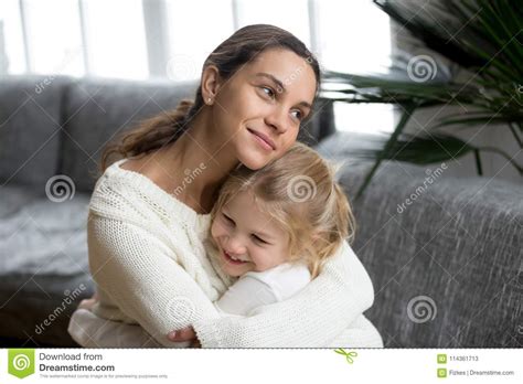 Loving Mother Hugging Little Daughter Showing Love Care And Sup Stock