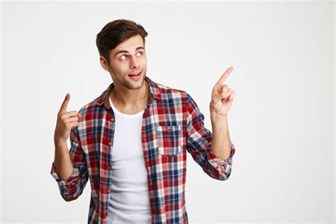 Free Photo Portrait Of A Young Smiling Man Pointing