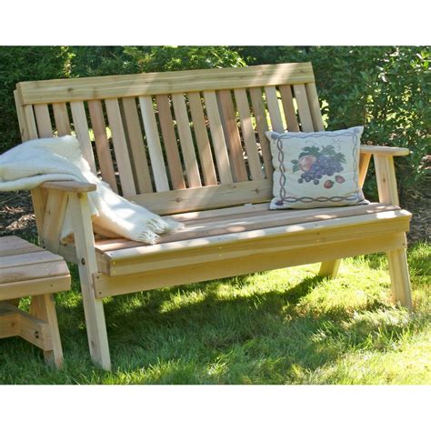 A bench is a welcomed feature in a garden. Cedar Countryside Garden Bench-OutdoorFurniturePlus.com