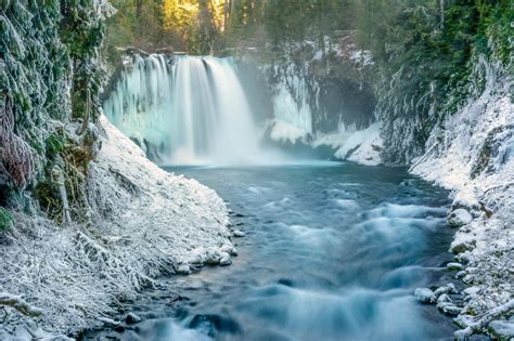 Waterfall In Winter Forest