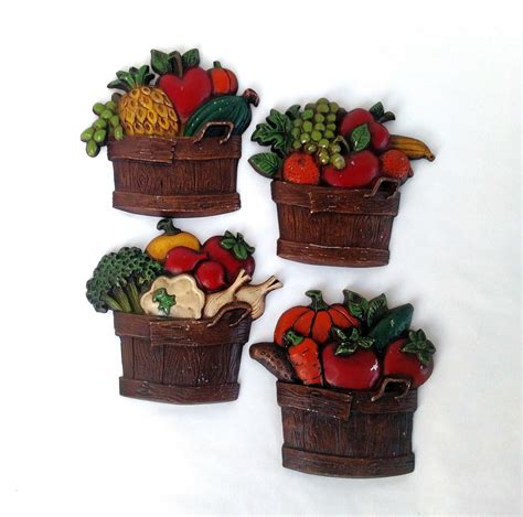 set of 4 vintage sexton metal wall plaques with basket of fruits and vegetables