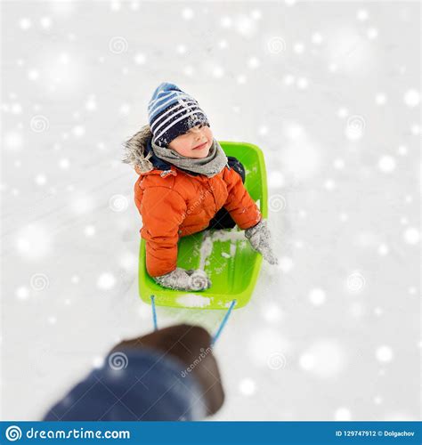 Happy Boy Riding Sled On Snow In Winter Stock Photo Image Of Rope