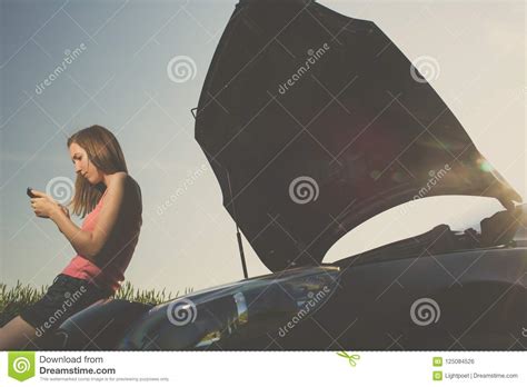 Pretty Young Woman By The Roadside After Her Car Has Broken Down Stock