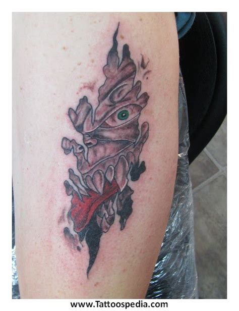 Tattoo Ripping Through Skin
