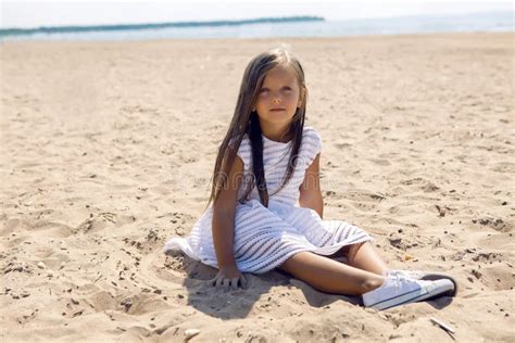 Portrait Of A Tanned Girl On The Sandy Beach Stock Photo Image Of