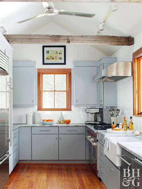 Now slaving over a hot stove is a fun thing to do. The light blue-gray color of the cabinets in this kitchen ...