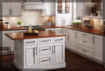 Here's one way to integrate a computer into your kitchen design. L-Shaped Kitchen - KraftMaid Cabinetry