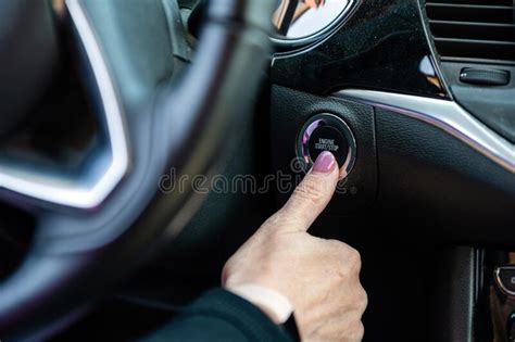 Woman Hand Pushing On Car Engine Start Stop Button Modern Car Interior