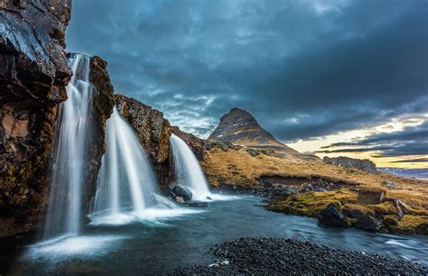 Kirkjufellsfoss Waterfalls And Kirkjufell Mountain At Sunrise In