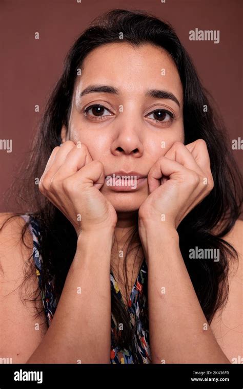 Indian Woman Holding Clenched Fists On Cheeks Closeup Portrait Cute