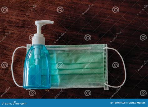 Picture Of Medical Surgical Mask And Alcohol Hand Sanitizer Wash Dirt