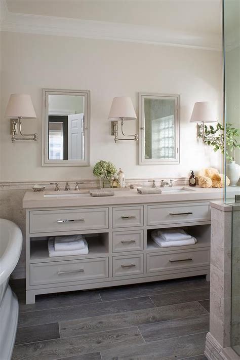 Combine gray with white and see how soft and soothing your bathroom can look. Cream and gray bathroom features top half of walls painted ...
