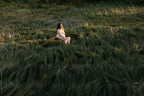 Nude Pregnant Woman In Field By Stocksy Contributor Serge Filimonov