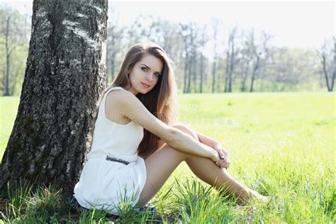 Girl Sits Under The Tree In The Meadow Stock Photo Image Of Natural