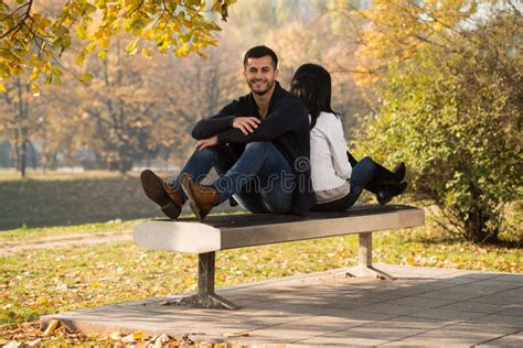 Romantic Couple On A Bench In Autumn Park Stock Photo Image Of