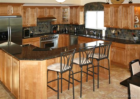 If your kitchen has dark cabinets, choose a lighter shade for the backsplash to keep the room from feeling too heavy. Metallic Barstools Wood Cabinet Dark Tile Kitchen ...